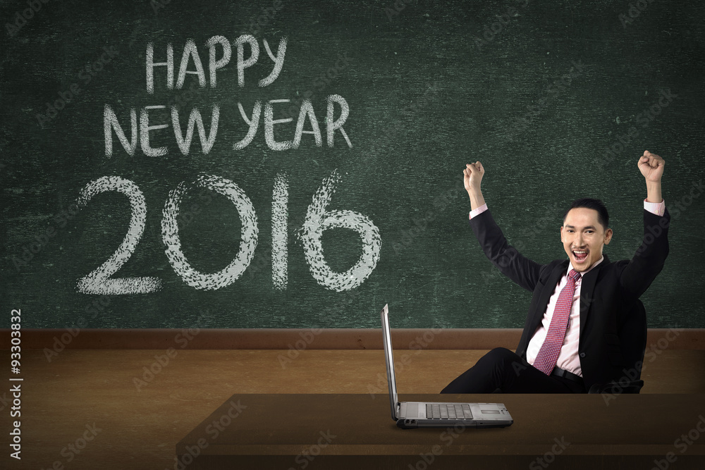 Business man in front of happy new year 2016 writing Business man in front of happy new year 2016 writing