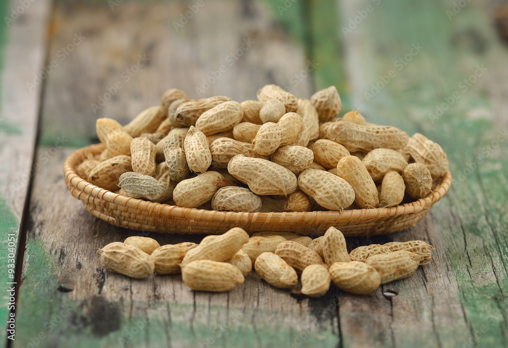 peanuts in the basket on wood peanuts in the basket on wood
