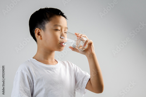 Boy drink water from glass
