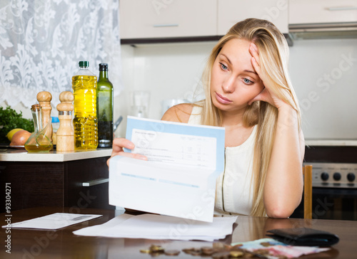 Sad   woman thinking about the financial problems