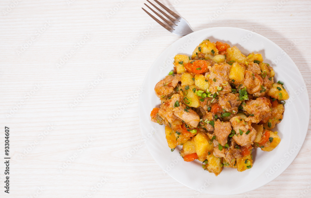stewed meat with potatoes, onion and carrot