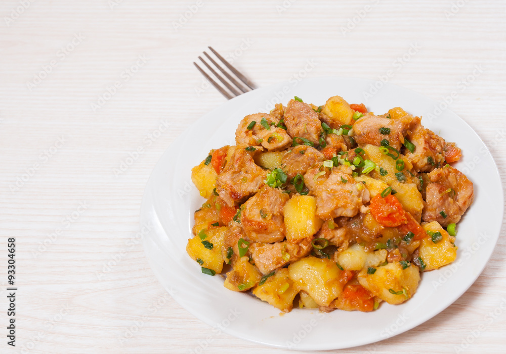 stewed meat with potatoes, onion and carrot