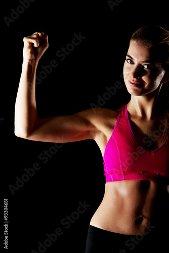 Woman shows her muscles
