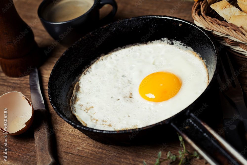 Breakfast setting with fried egg and coffee Breakfast setting with fried egg and coffee