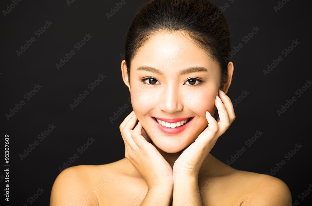 Fototapeta premium beautiful young smiling woman with clean face