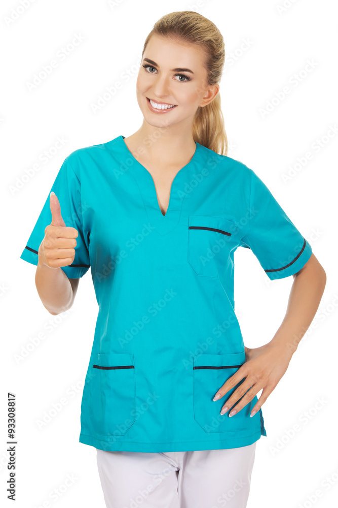 Smiling woman doctor or nurse with thumb up