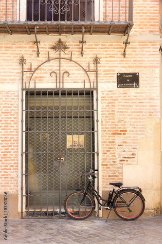 Bicycle outside door in Malaga, Andalucia, Spain photo