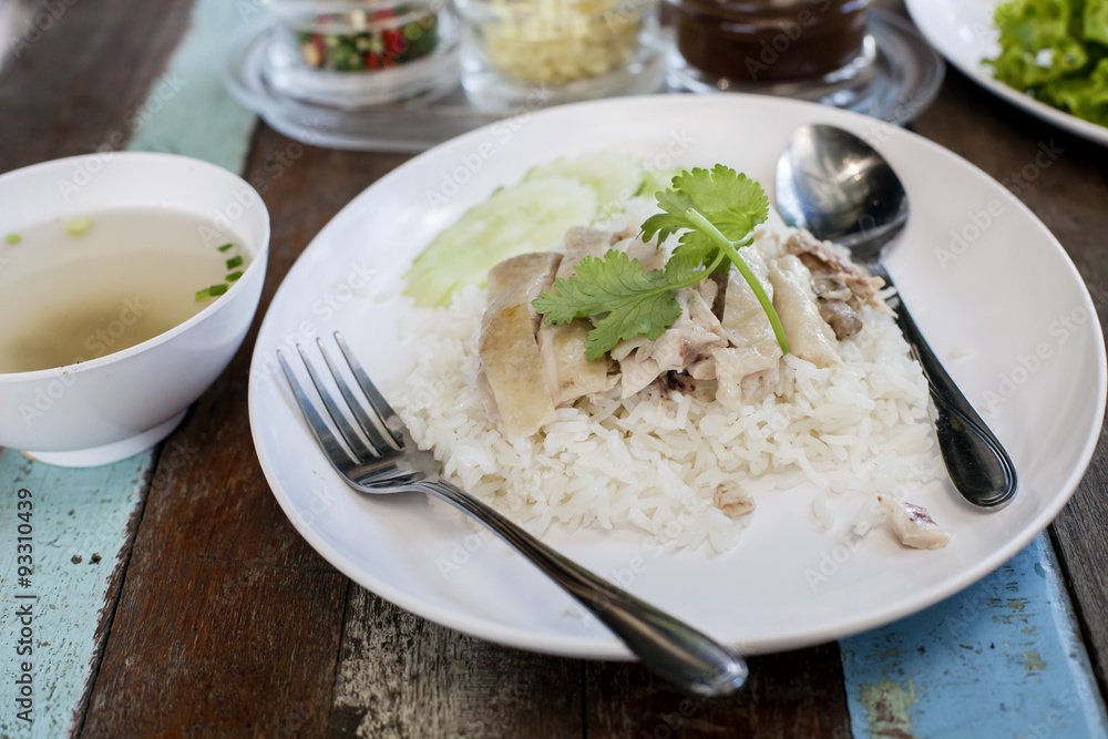 Thai food gourmet steamed chicken with rice ,in wood background.