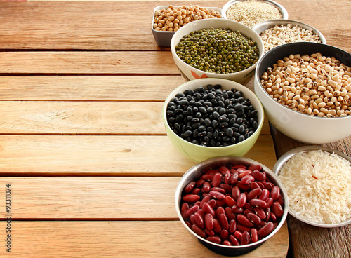 Different kinds of Grains, five grains put on wooden background.