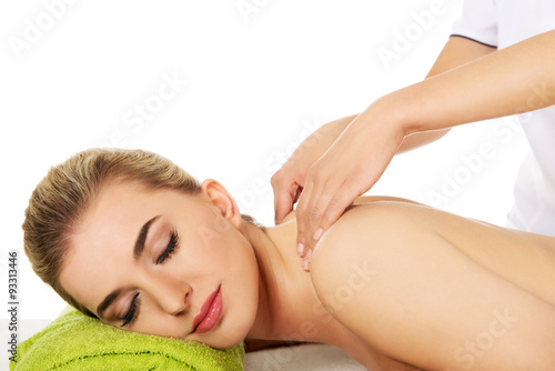 Young woman is being massaged. 