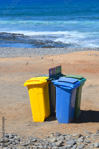 Recycle bins on the beach.