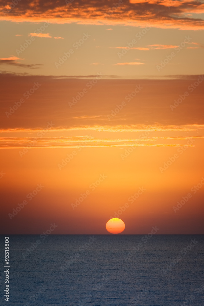 Orange sunset at the sea with sun
