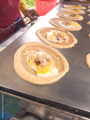 Tokyo snack. Egg and chicken with sausage wrapped up with flour. photo