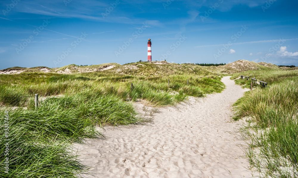 Dune landscape with lighthouse at North Sea - obrazy, fototapety, plakaty 