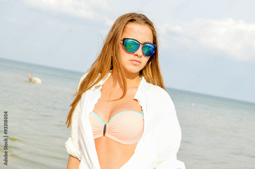 Closeup portrait of sexi redhead woman in unbuttoned white shirt Closeup portrait of sexi redhead woman in unbuttoned white shirt
