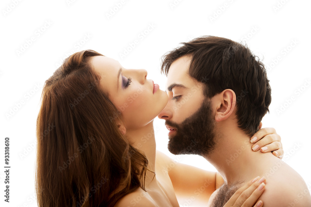 Man pretending to kiss woman's neck. Man pretending to kiss woman's neck.