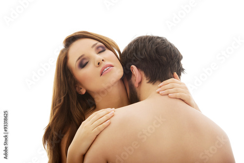 Handsome man kissing woman's neck.