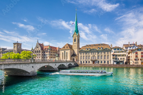 Zürich city center with boat on river Limmat, Switzerland photo