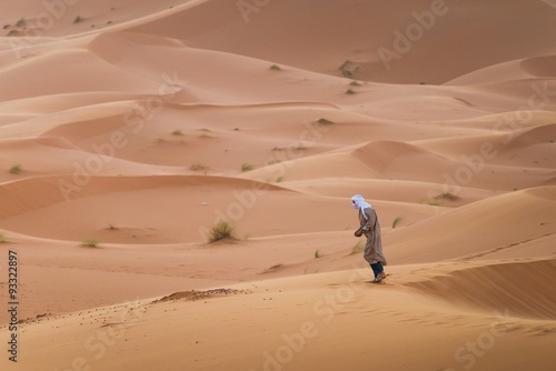 a touareg walking in the desert