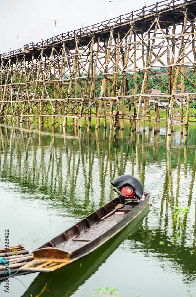 Fototapeta premium boat at wooden bridge Sangkhlaburi,Kanchanaburi,Thailand/Most famust visit in Thailand