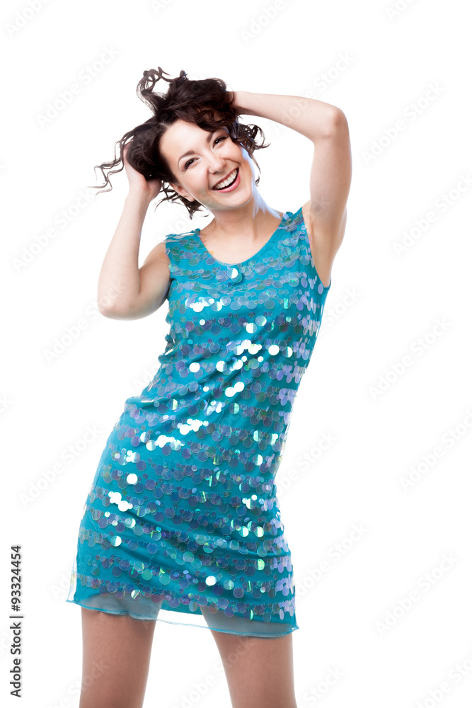 Attractive young woman dancing in short sparkling blue dress Attractive young woman dancing in short sparkling blue dress