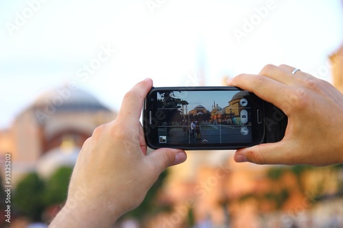 Canvas Print taking a photo with his phone in Istanbul