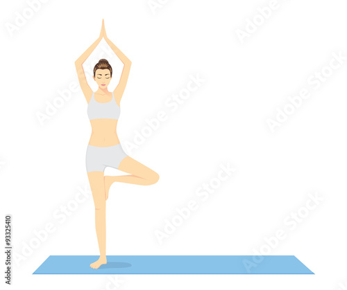 Woman beginning in Yoga with Tree Pose or Vrksasana on blue exercise mat. This pose is performed to warm up.