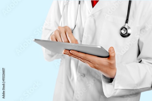 Doctor with tablet.