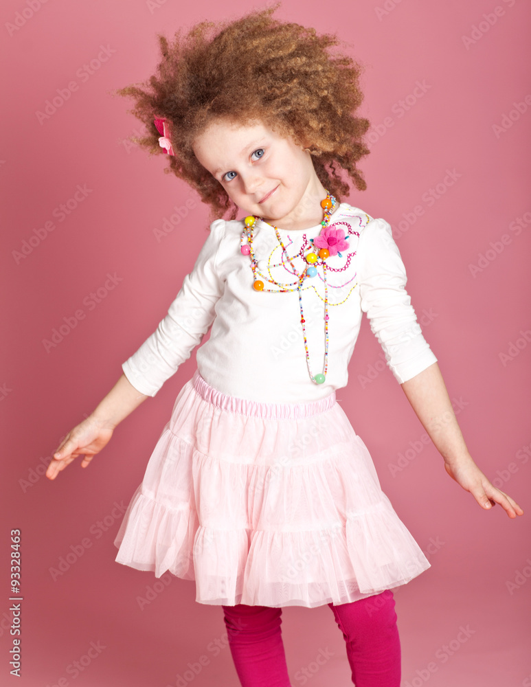 Happy curly girl in a scarf in studio Happy curly girl in a scarf in studio