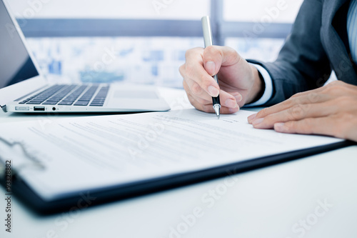 Business man signing a contract