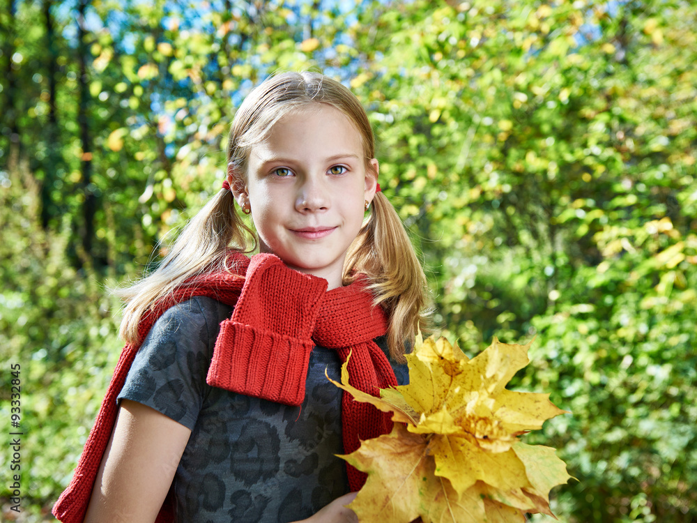Joyful girl with yellow leaves in autumn park on sunny day Joyful girl with yellow leaves in autumn park on sunny day