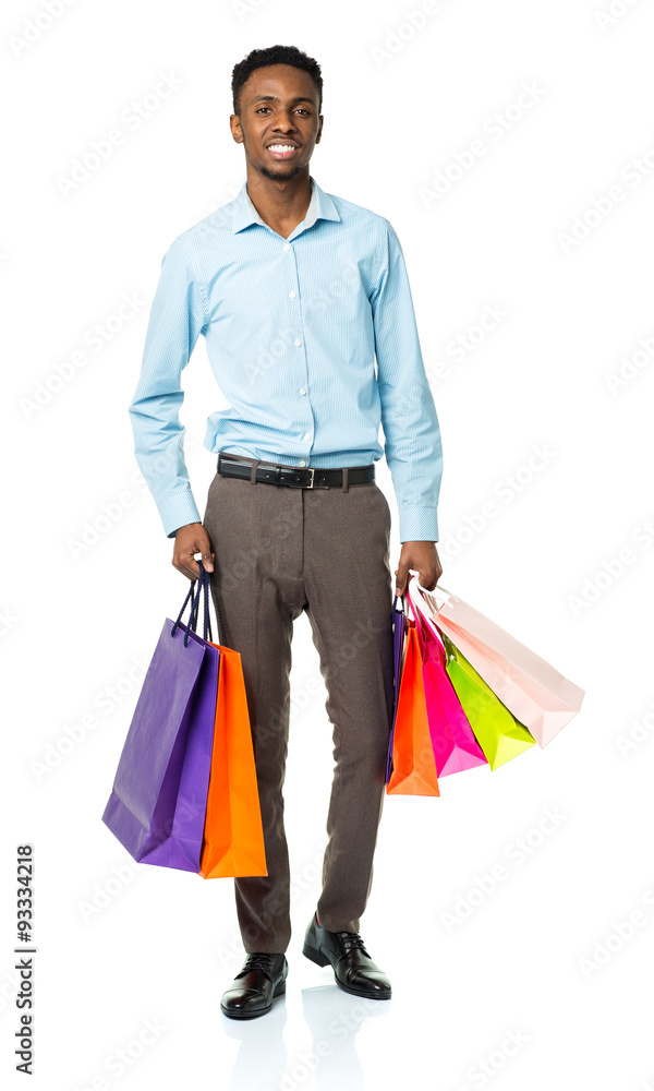 Happy african american man holding shopping bags on white backgr Happy african american man holding shopping bags on white backgr