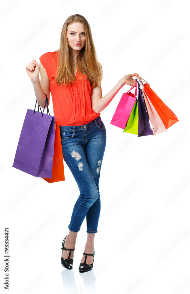 Happy lovely woman with shopping bags over white