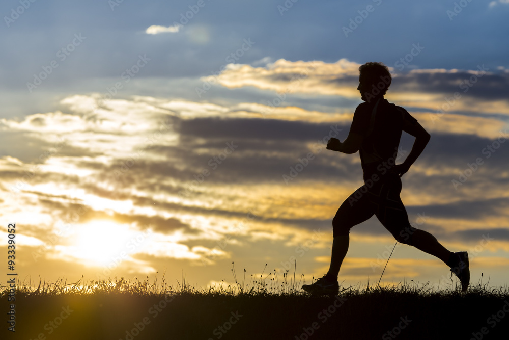 silhouette of a jogger in sunrise