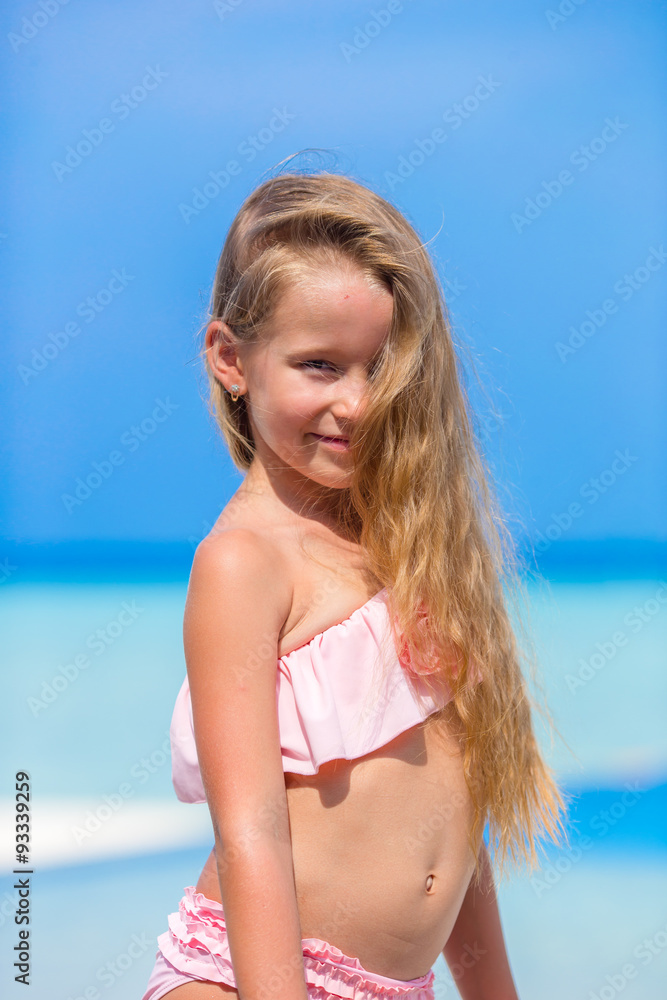 Portrait of beautiful little girl outdoor on beach vacation Portrait of beautiful little girl outdoor on beach vacation