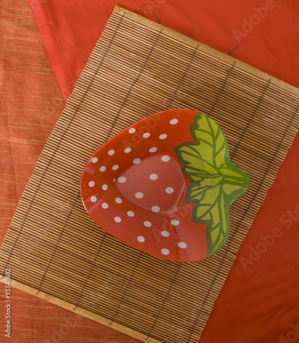 Children plate on a red background
