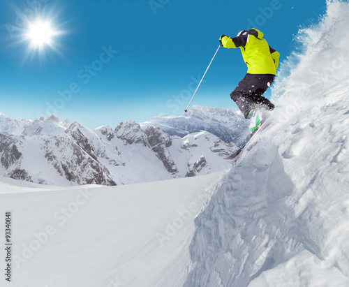 Jumping skier at jump