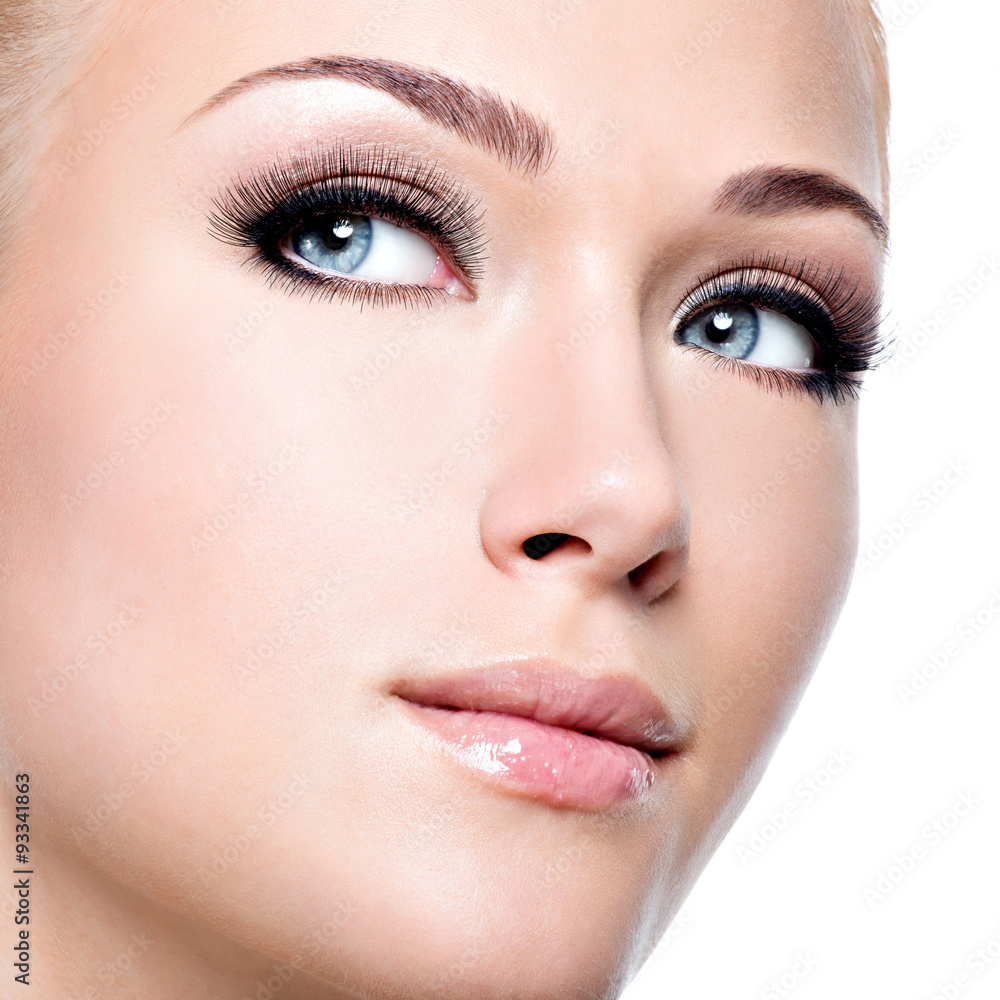 portrait of beautiful white woman with long false eyelashes portrait of beautiful white woman with long false eyelashes