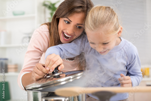 Mother And Daughter In The Kitchen