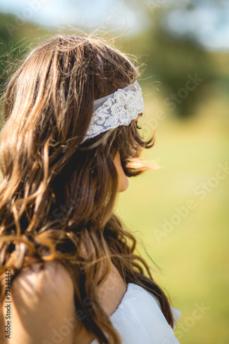 the bride in a wedding dress with a white band on the hair