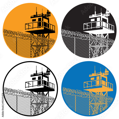 watchtower and barbed wire