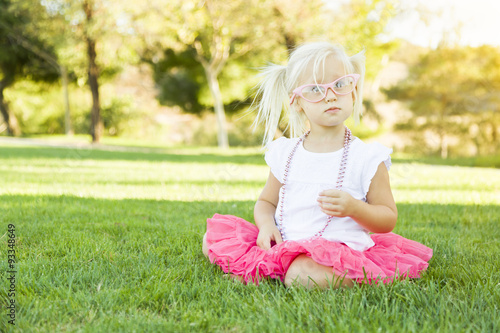Little Girl Playing Dress Up With Pink Glasses and Necklace © Andy Dean
