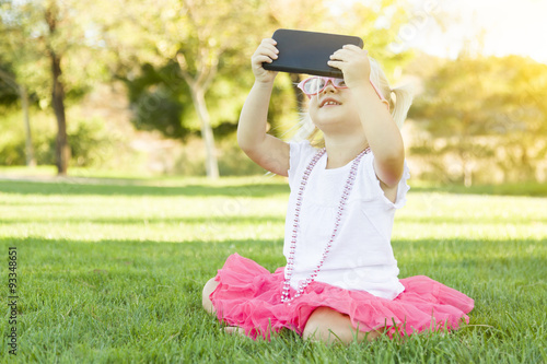 Little Girl In Grass Taking...