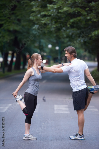 jogging couple stretching