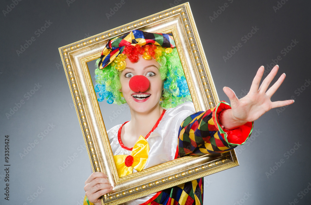 Fototapeta premium Clown with picture frame in funny concept