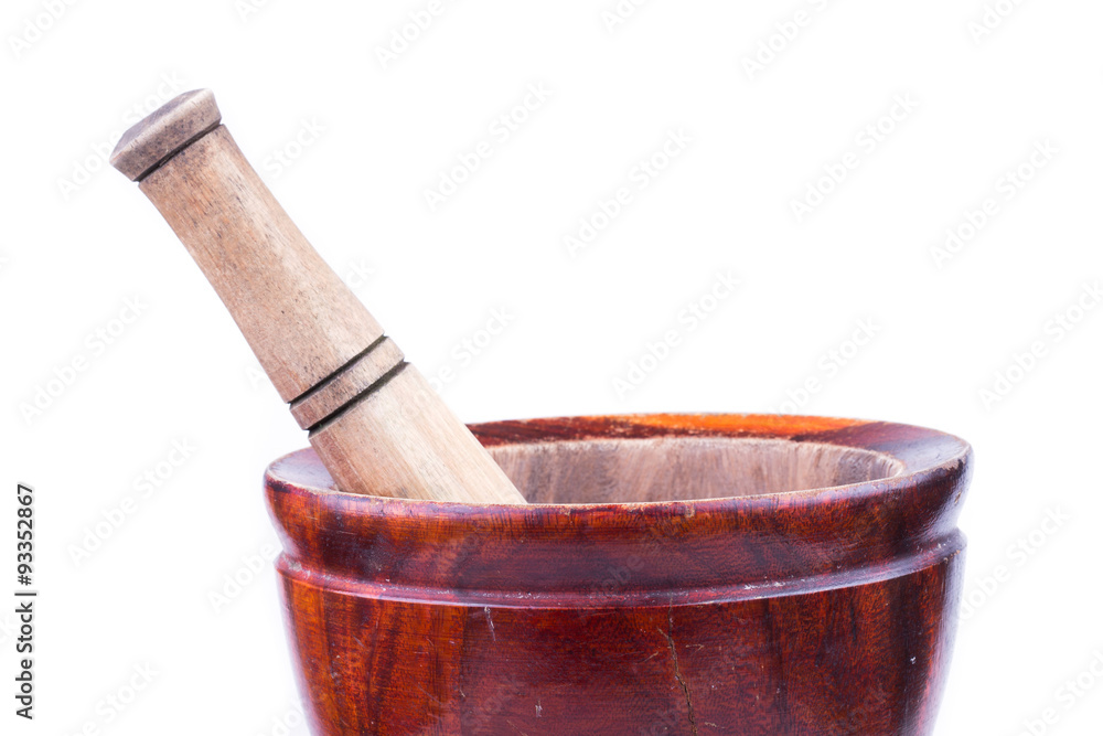 wooden mortar and pestle isolated on white background