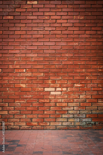 old brick wall weathered texture and dirty floor background