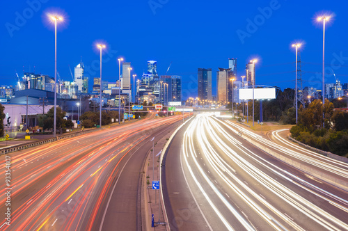 High speed traffic and light trails in highway at twilight
