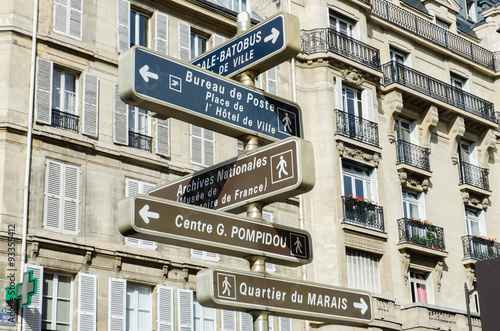 Street sign with directions in Paris