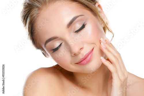 Young woman touching her face isolated on white background